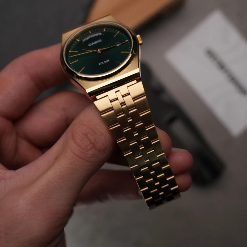 Чоловічий годинник Casio MTP-B146G-3A з зеленим циферблатом та золотистим браслетом